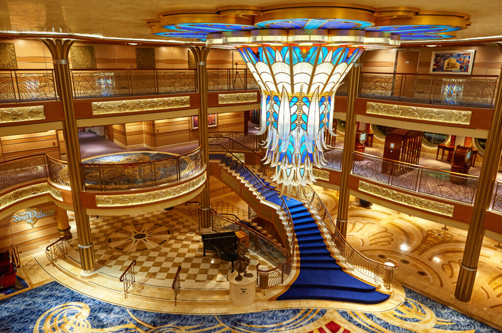 Disney Wish grand atrium with chandelier and royal staircase in Disney Alaska Cruise